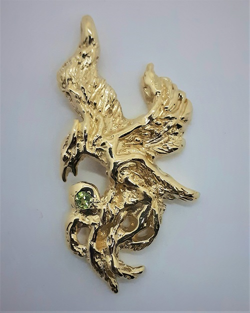 9 carat gold phoenix pendant set with and apple green peridot stone